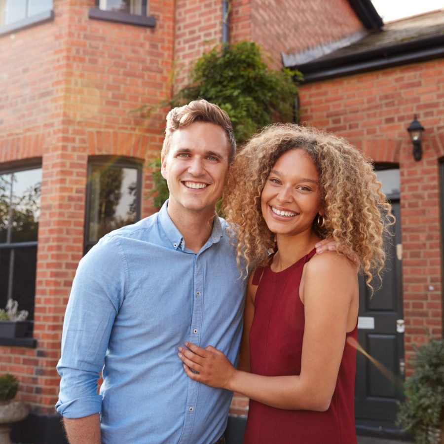 portrait-of-excited-young-couple-standing-outside-2024-10-20-18-45-41-utc